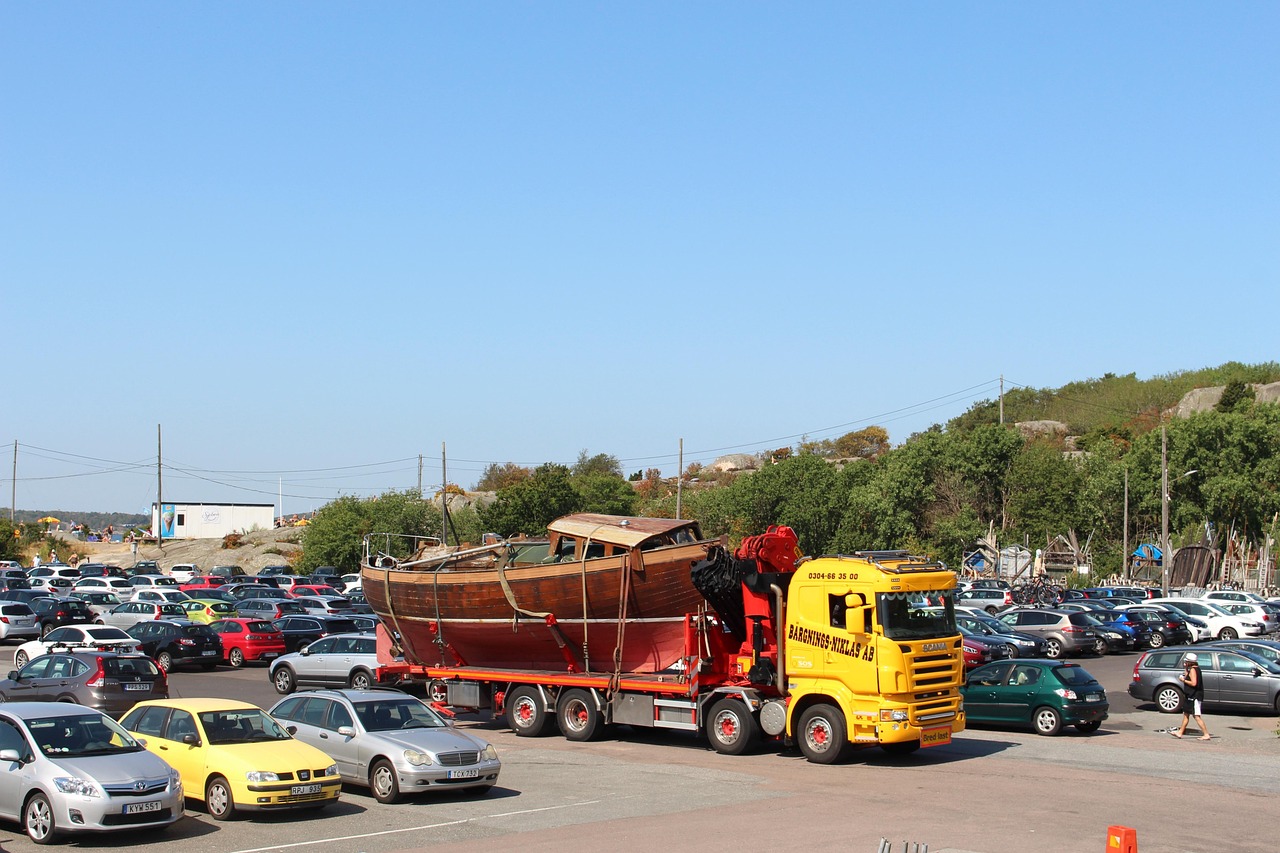 Tow truck parked near a busy parking lot